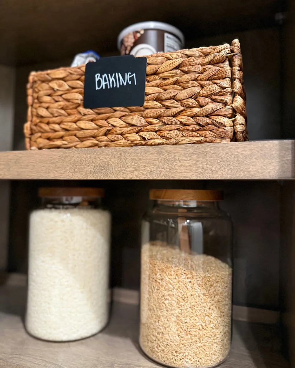 Labeled baking pantry with jars and baskets